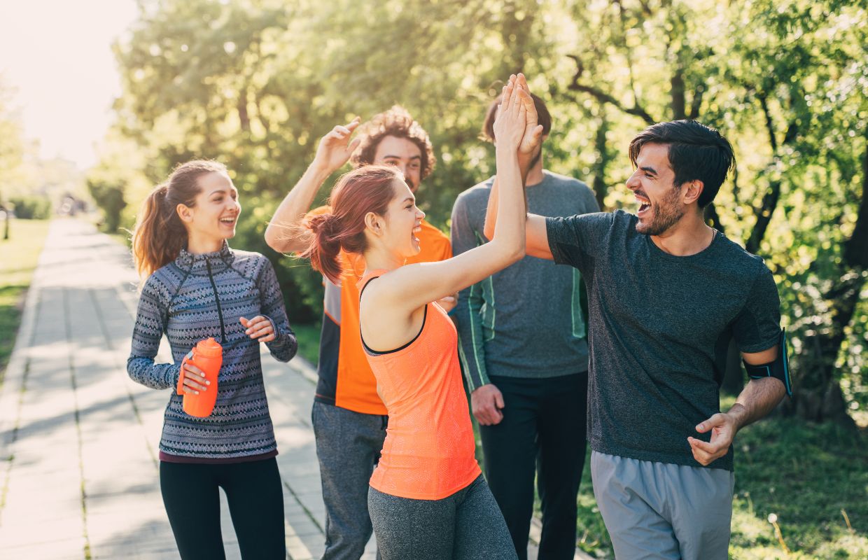 Group of people celebrating after workout